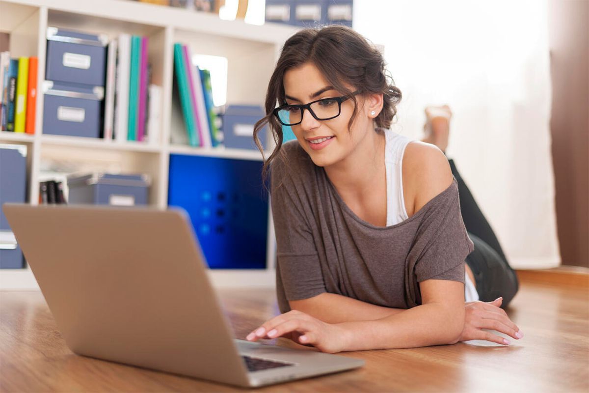 Girl with her laptop easily configuring her website backup