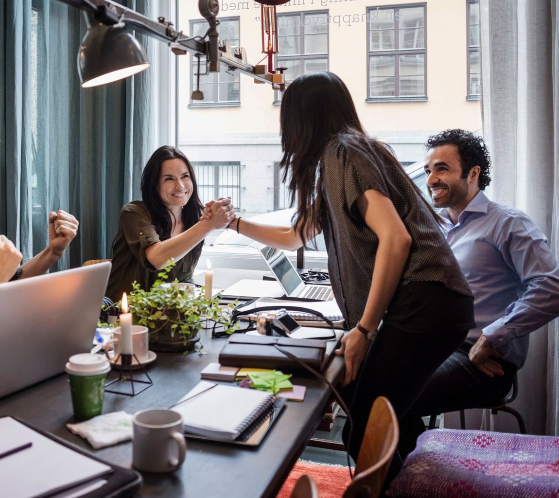 Colleagues sharing ideas for creating their website with WordPress Hosting