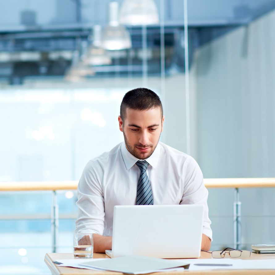 Boy checking on his laptop which directories his business is listed in with Find Your Business