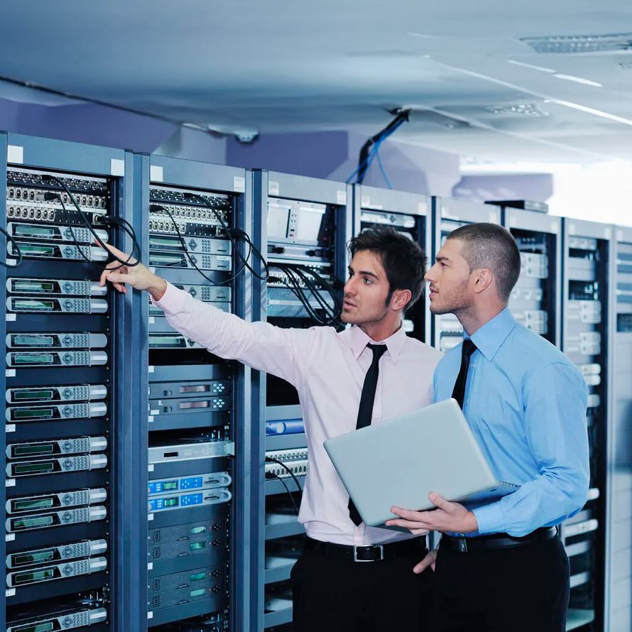 IT professionals in a data center checking cloud backup servers