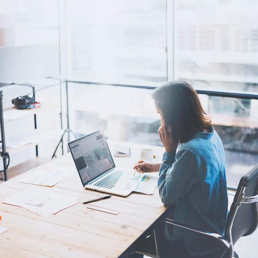 IT professional answers a client's project requirements by phone.