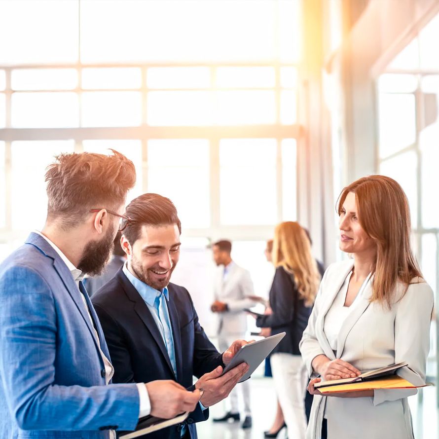 Happy colleagues with Kasten K10 Veeam, the native backup for Kubernetes environments.