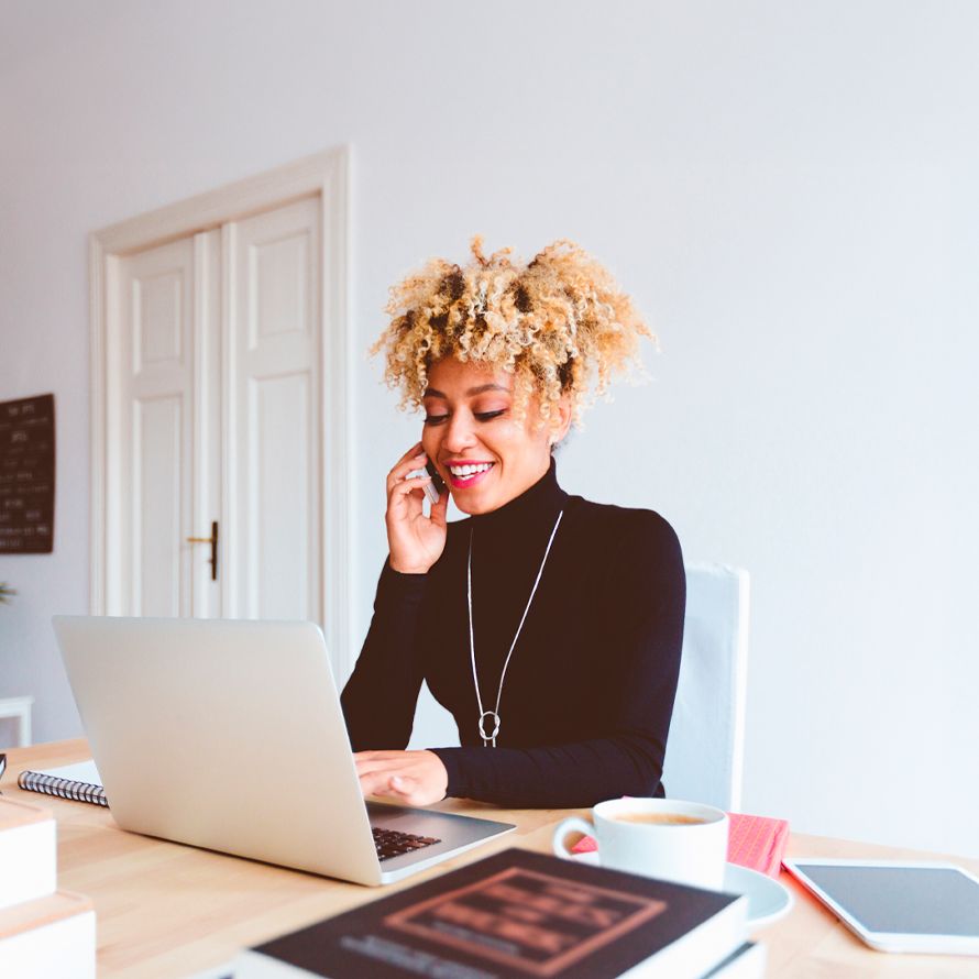 Girl talking on the phone, happy with her custom email and Office 365 solution