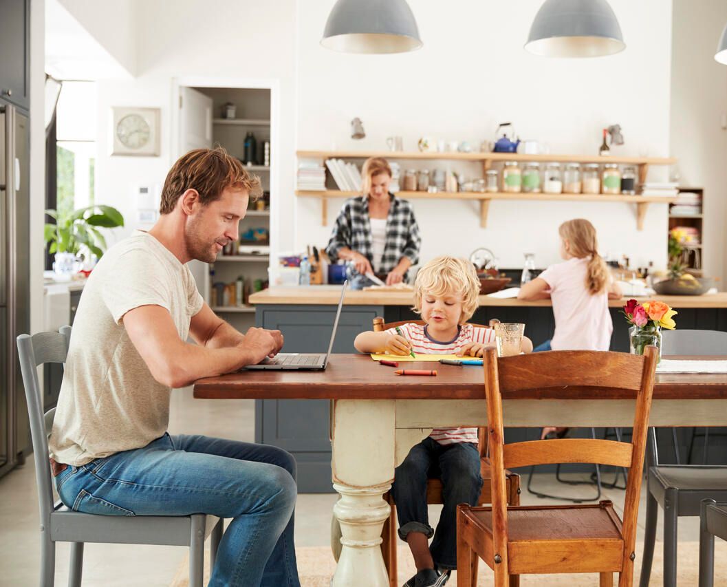 Happy family in the kitchen of their home