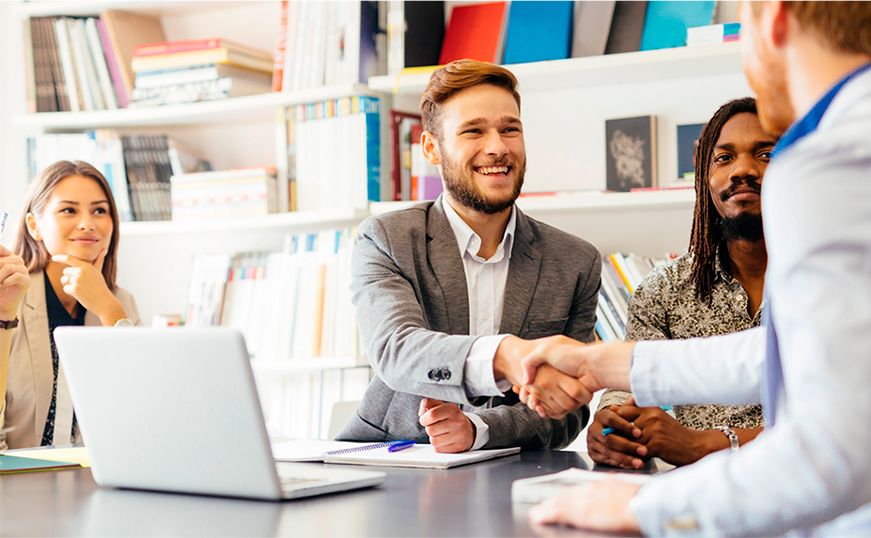 Handshake during a work meeting because an innovative solution has been found