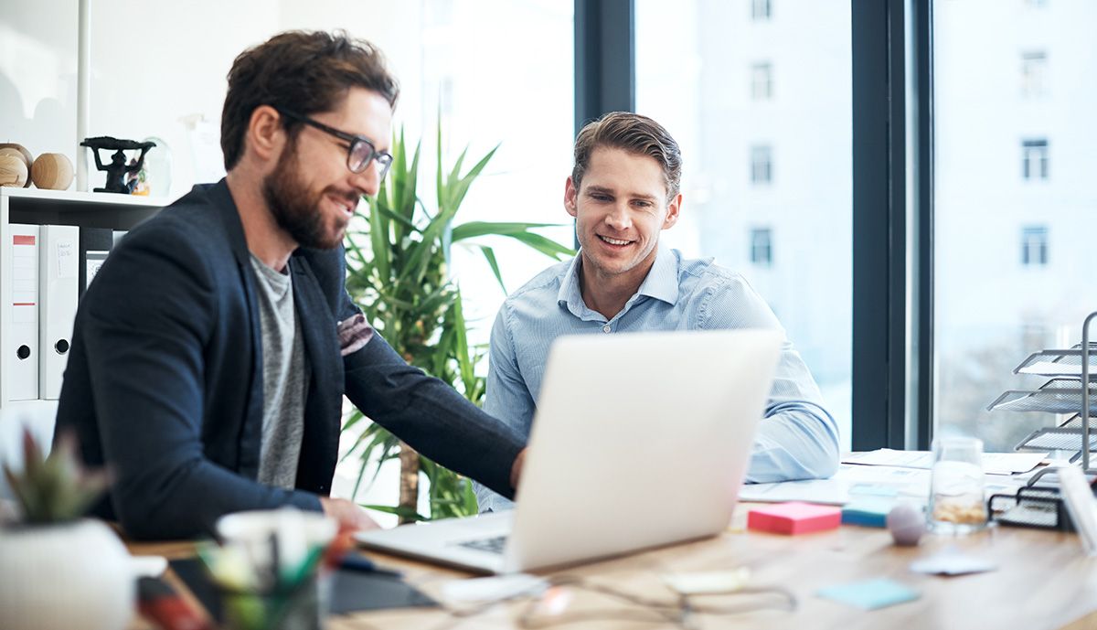 Two coworkers checking the operation of the Windows VPS